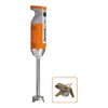 A professional studio shot of an immersion blender and its blade attachment. Produktbild-Vorschau