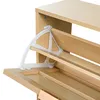 A close-up view of a wooden shoe cabinet with a white plastic hinge mechanism. Podgląd zdjęcia produktu