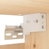 Close-up of a white mounting bracket attached to a wooden surface. Voir les images du produit