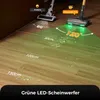 A close-up view of two vacuum cleaners on a wooden floor, with one prominently displaying green LED lights and highlighting its cleaning range with superimposed graphics and text. Produktbild-Vorschau