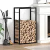 A black metal firewood rack filled with logs next to a fireplace. Náhľad obrázku produktu
