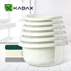 A stack of white plastic bowls is shown in the foreground, with a logo and text in the background. Produktbild-Vorschau