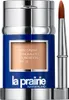 A bottle of La Prairie Skin Caviar Concealer Foundation SPF 15 with an applicator brush. Produktbild-Vorschau