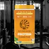 A product shot of a protein powder container in a gym setting. Produktbild-Vorschau