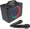 A black portable karaoke machine with a colorful LED light ring and two microphones in front of it, set against a white background. Produktbild-Vorschau