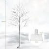 A decorative LED birch tree with a base and dimensions shown, set against a snowy, bokeh background. Anteprima dell’immagine prodotto
