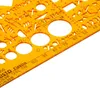 A close-up view of an orange plastic drafting template with various geometric shapes and measurement markings. Náhľad obrázku produktu