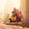 Wall-E figurine in a post-apocalyptic, trash-filled environment. Anteprima dell’immagine prodotto
