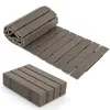 A rolled-up and stacked garden path made of composite material, shown on a white background. Náhľad obrázku produktu