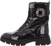 A studio shot of a black patent leather boot. Produktbild-Vorschau