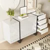 A modern white sideboard with black trim is displayed in a room setting, featuring decorative items and artwork. Anteprima dell’immagine prodotto