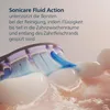 Close-up of a toothbrush head cleaning teeth, with water splashing. Anteprima dell’immagine prodotto