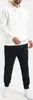 A person wearing a white hoodie and black sweatpants. Produktbild-Vorschau