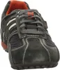 A close-up, front-facing view of a single dark gray sneaker with orange and white accents. Produktbild-Vorschau