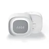 A white digital alarm clock with a gray fabric speaker grille displaying the time. Anteprima dell’immagine prodotto