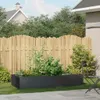 A raised garden bed filled with plants in a backyard setting. Náhled obrázku produktu