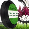 A roll of black garden edging is shown next to a decorative garden border with plants and stones. Podgląd zdjęcia produktu