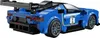 Rear view of a blue Lego race car with a large spoiler. Produktbild-Vorschau