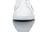 A close-up front view of a white Puma Smash V2 L sneaker, reflected on a white surface. Podgląd zdjęcia produktu
