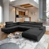 A modern living room scene featuring a large, dark sectional sofa. Podgląd zdjęcia produktu