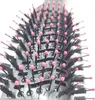 A close-up view of the bristles and barrel of a round hairbrush. Podgląd zdjęcia produktu