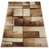 A rectangular rug with a geometric pattern is shown from a slightly elevated angle against a white background. Náhled obrázku produktu