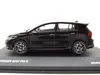A black Volkswagen Golf VIII R model car is displayed on a black base. Produktbild-Vorschau