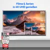 A television screen displaying a mountain landscape with different resolution examples (UHD, FHD, HD) overlaid. There are also marketing badges on the bottom left. Produktbild-Vorschau