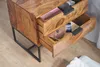 A close-up view of a wooden nightstand with two open drawers, revealing some items inside. Podgląd zdjęcia produktu