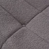 A close-up view of a textured gray fabric, likely a sofa or cushion, showing its quilted pattern. Produktbild-Vorschau