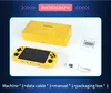 A yellow handheld gaming console, its packaging box, a manual, and a USB cable are arranged on a white surface. Produktbild-Vorschau