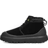 A side view of a black UGG motorcycle boot against a white background. Voir les images du produit