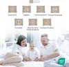 A family (mother, father, and baby) sitting on a bed. Produktbild-Vorschau