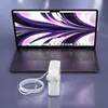 A laptop and its charger are shown on a reflective surface. Produktbild-Vorschau