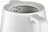 A close-up view of the top opening of a white ceramic kettle, showing the integrated tea strainer. Produktbild-Vorschau