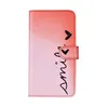 A pink and red gradient phone case with the word "smile" and hearts printed on it. Produktbild-Vorschau
