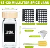 A collection of spice jars and accessories, including labels, a marker pen, a funnel, and a cleaning brush, presented against a white background. Produktbild-Vorschau