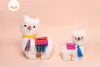 Two stuffed llamas with colorful blankets and tassels. Produktbild-Vorschau