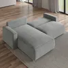 A grey sectional sofa with a chaise lounge is shown in a room with hardwood floors and a rug. Produktbild-Vorschau