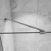 A close-up view of a shower screen support arm attached to a glass panel and a tiled wall. Produktbild-Vorschau