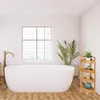 A clean and modern bathroom with a freestanding bathtub and a wooden corner shelf. Podgląd zdjęcia produktu