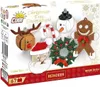 The image shows the packaging of a Cobi Christmas Tree Decorations set, featuring various festive ornaments made from building blocks. Voir les images du produit