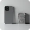A smartphone and a portable charger are placed on a white surface against a light gray background. Náhled obrázku produktu