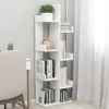 A white modern bookshelf filled with books and a plant, next to a chair and a desk with a potted plant. Náhled obrázku produktu