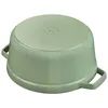 The bottom of a green cast iron pot is shown against a white background. Produktbild-Vorschau