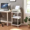 A home office setup with a computer, printer, and a rolling printer stand. Voir les images du produit