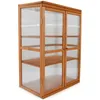 A wooden greenhouse with clear panels and shelves, shown against a white background. Produktbild-Vorschau