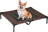 A corgi dog sitting on a brown and black elevated pet bed against a white background. Produktbild-Vorschau