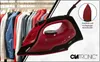 A red and black steam iron is shown in the foreground, with a rack of colorful shirts in the background. A close-up inset shows the iron's soleplate. Náhled obrázku produktu