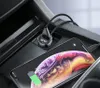 A car's interior, showing a phone charging via a car charger. Produktbild-Vorschau